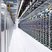 A large-scale Bitcoin mining farm with rows of mining rigs