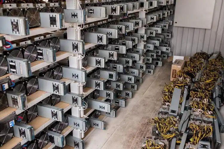 A large cryptocurrency mining farm with multiple rigs